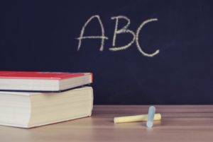 A chalkboard with the word abc written on it.
