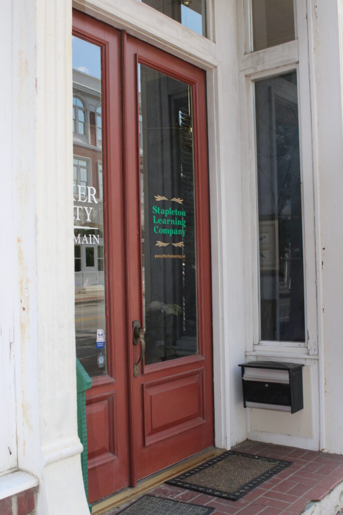 A door with the sign " welcome to " written on it.