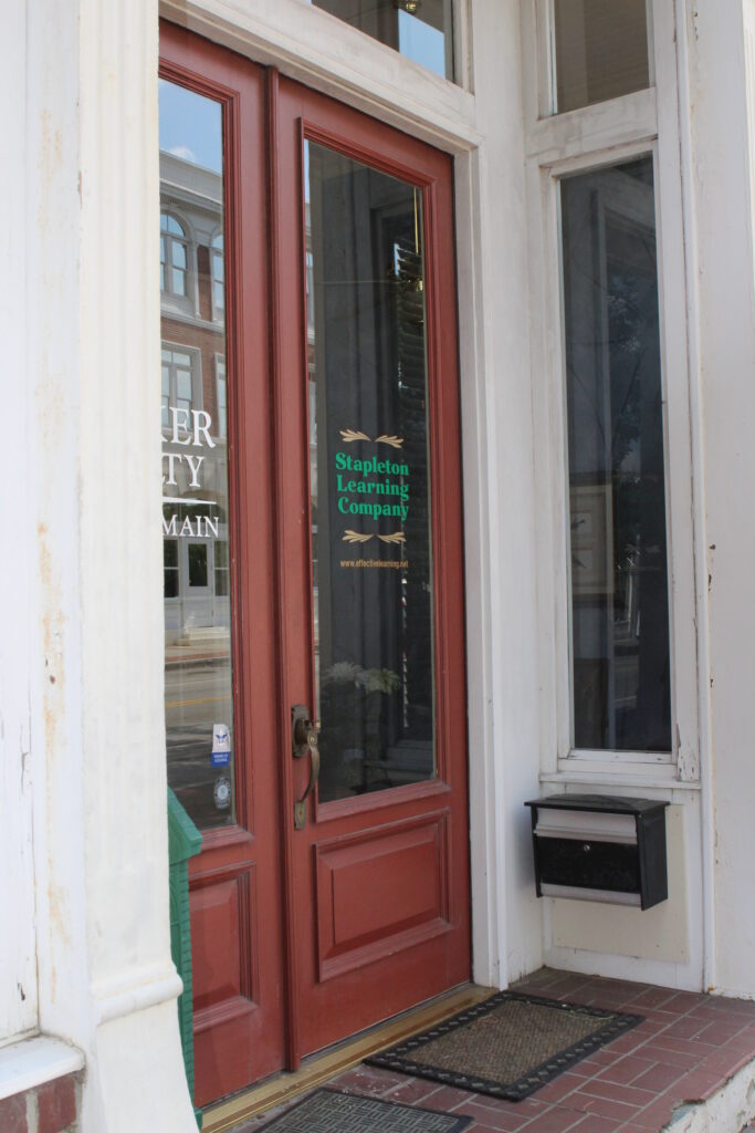 A door with the sign " business " written on it.
